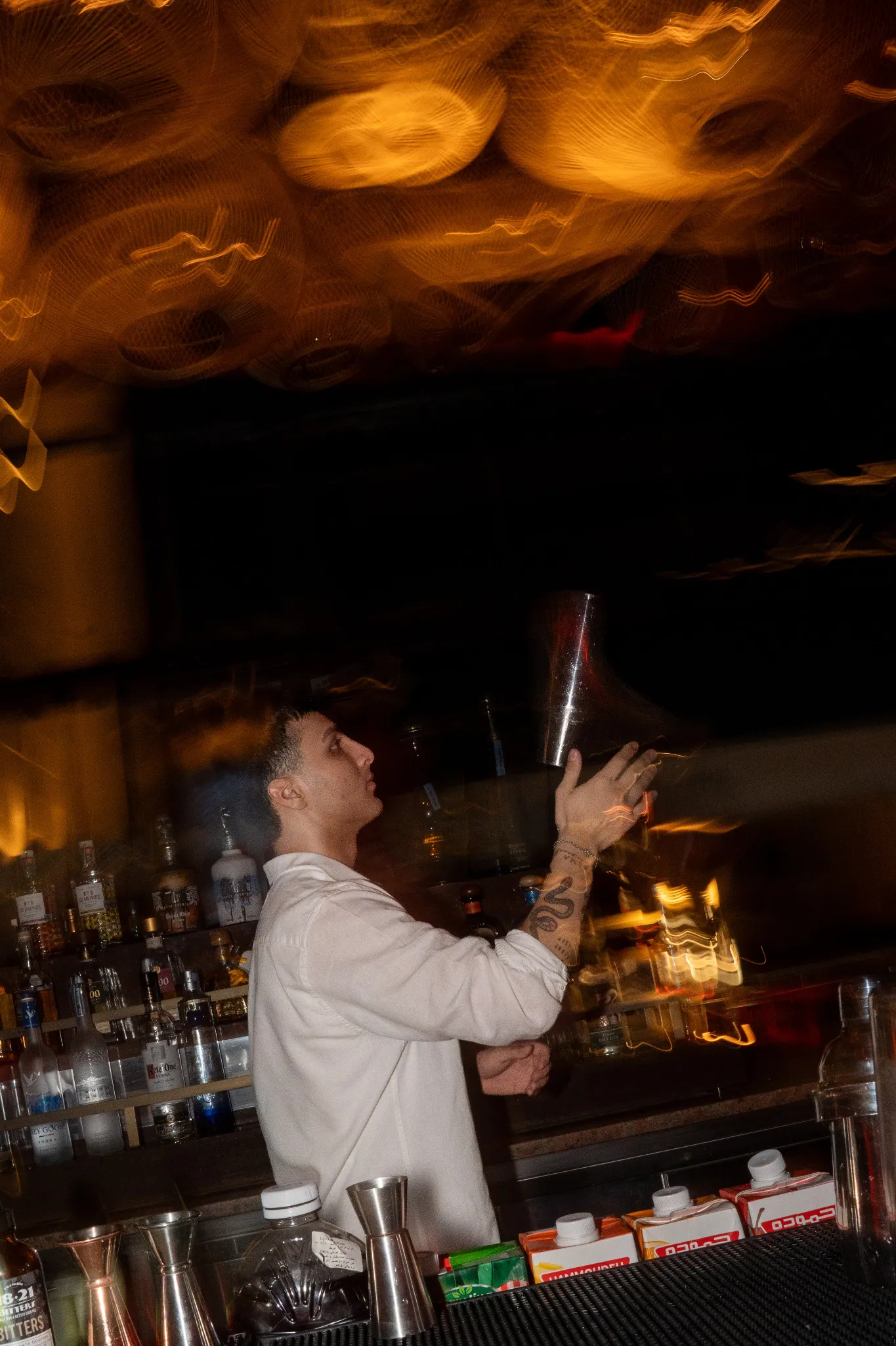Nasim Fairmont Amman lounge — bartender working behind the bar