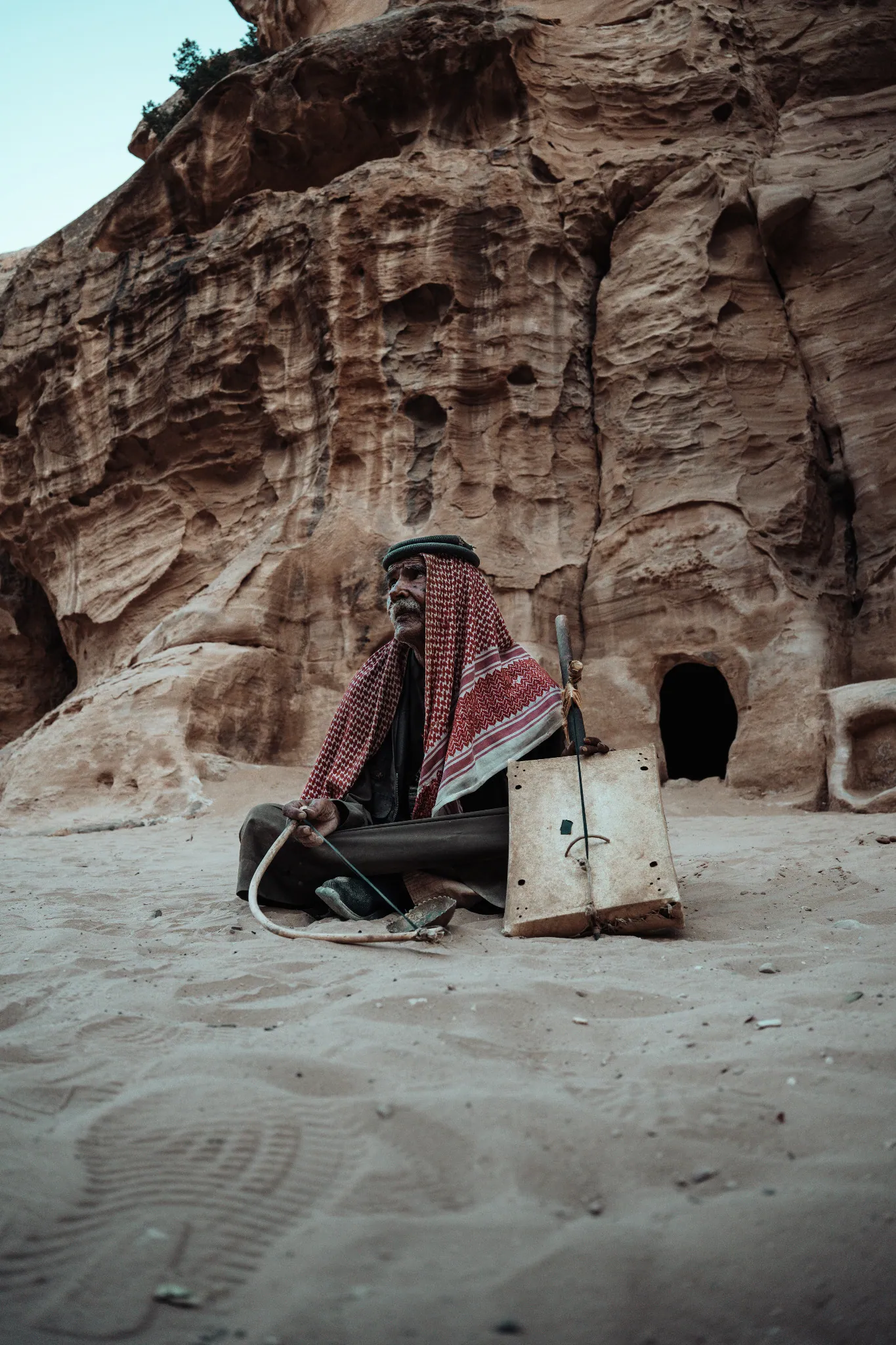 Documentary portrait of a seated man in Petra, Jordan